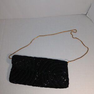 Mister Ernest: Vintage black beaded clutch bag with chain strap.